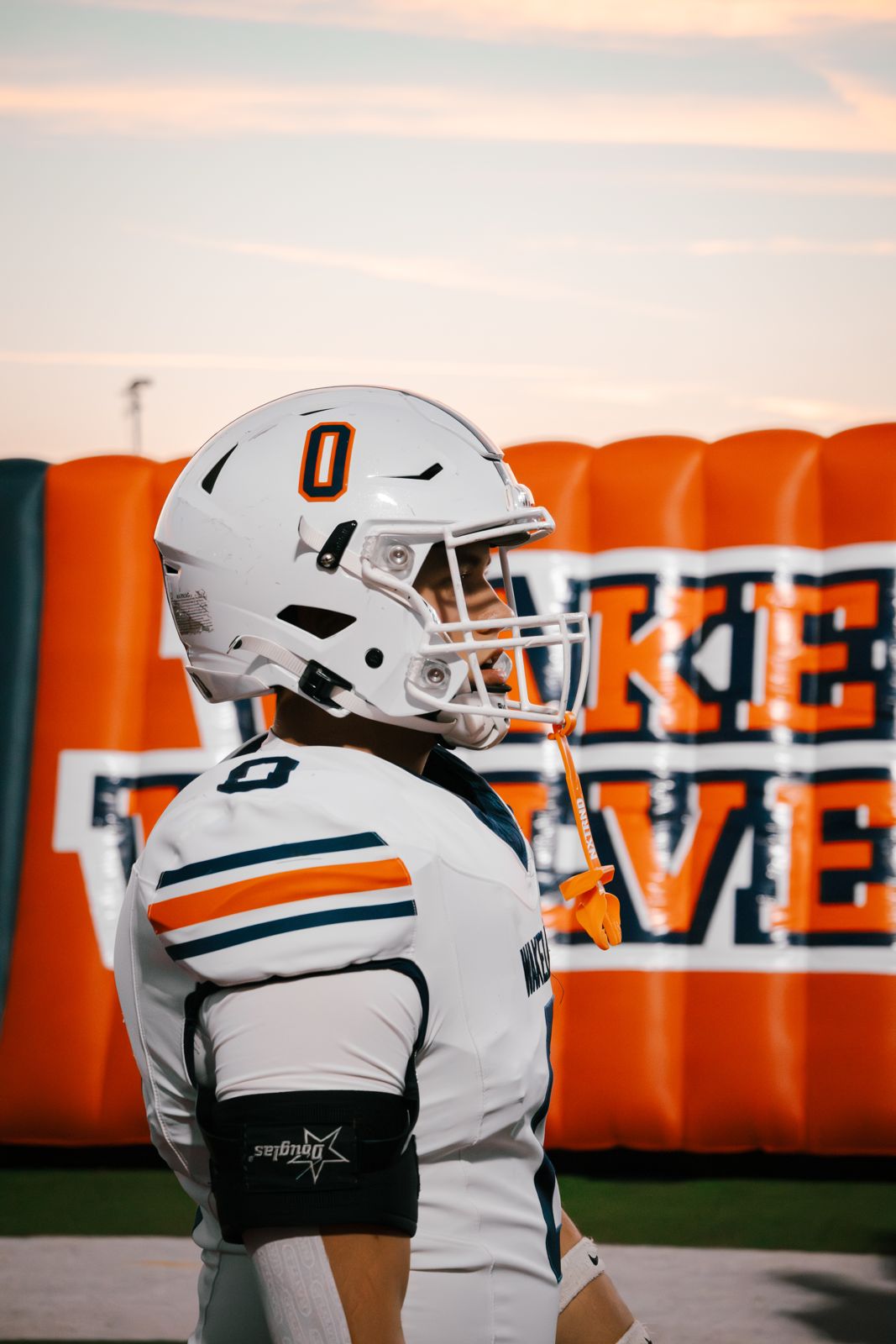 Wakeland player in front of the tunnel at sunset