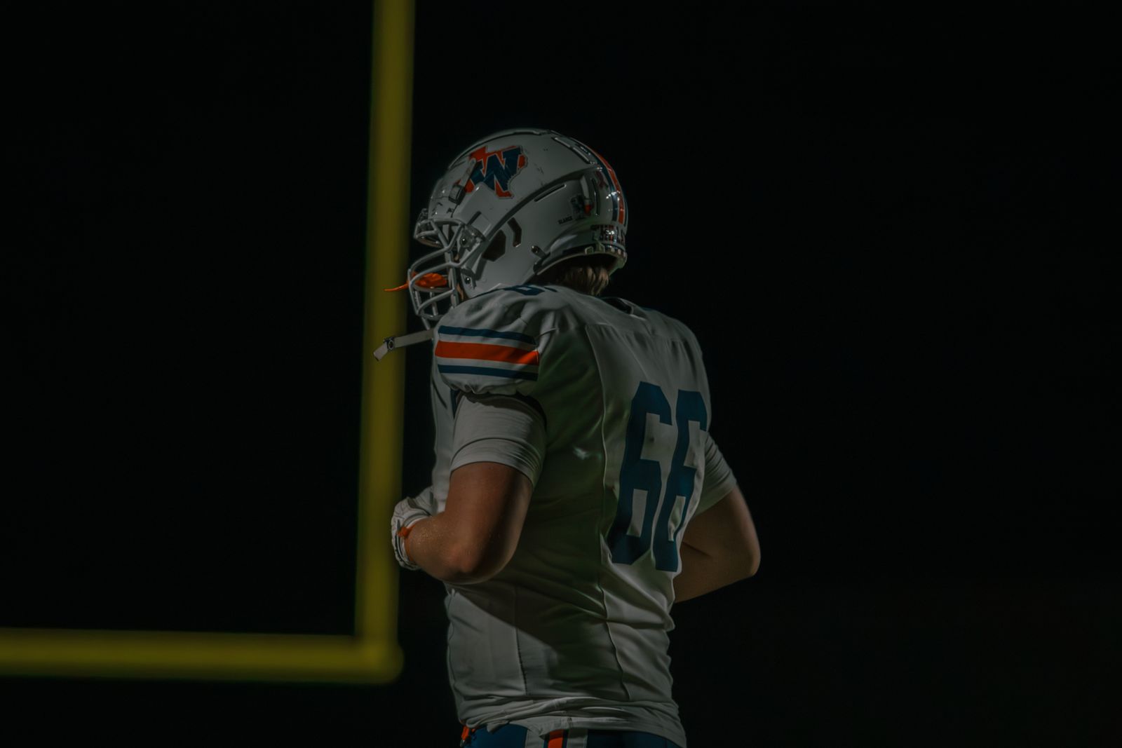 Wakeland lineman under the goalposts