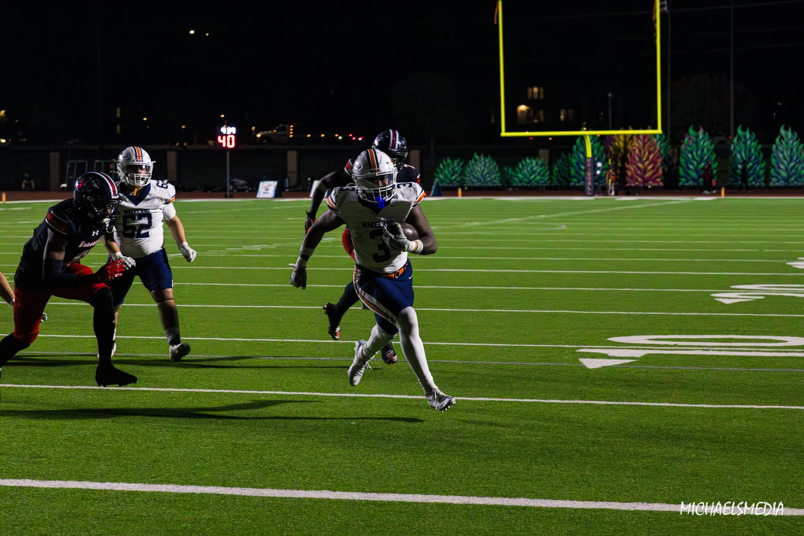 Ball carrier breaking into the open field
