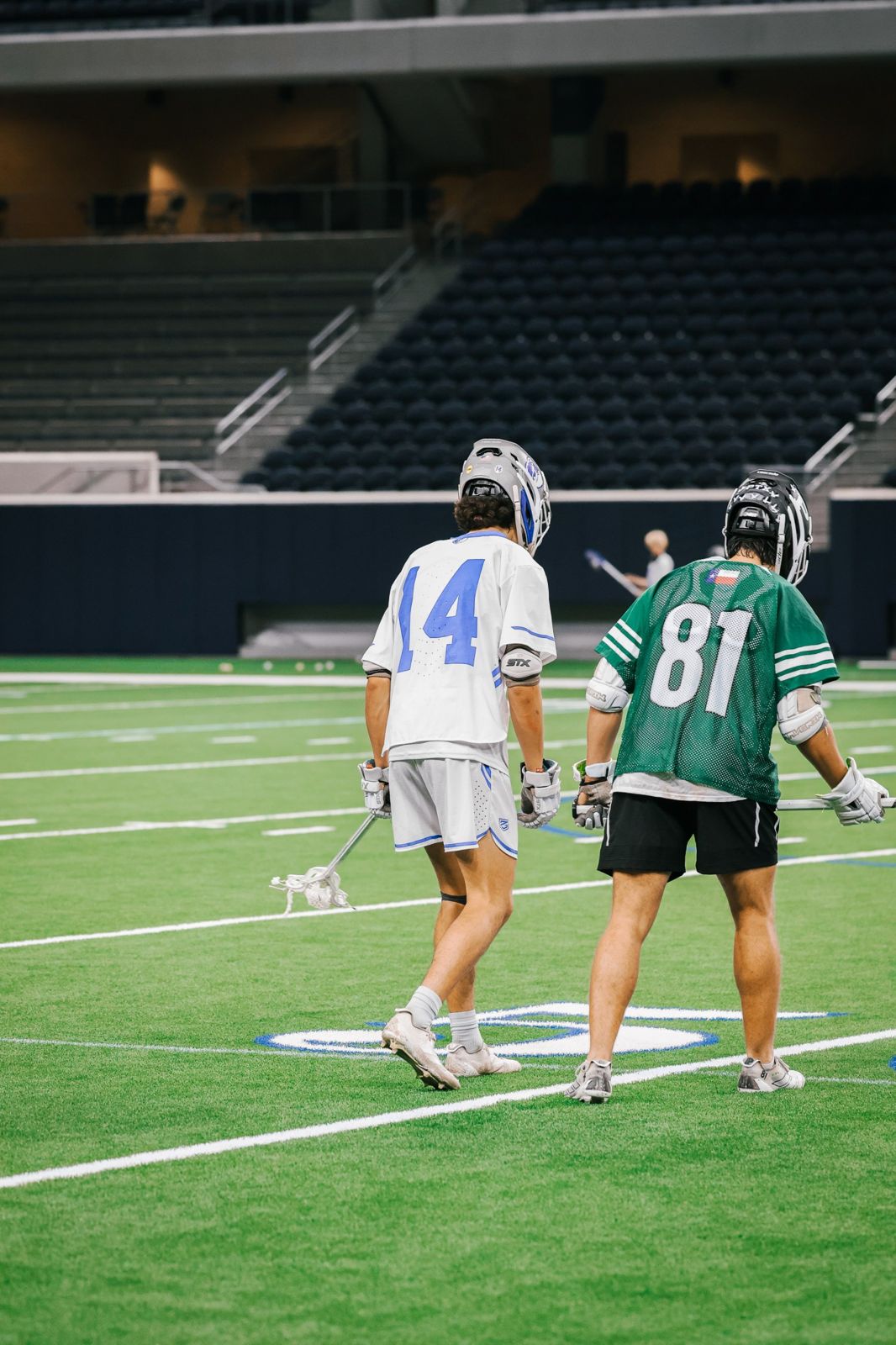 Lacrosse players at the faceoff