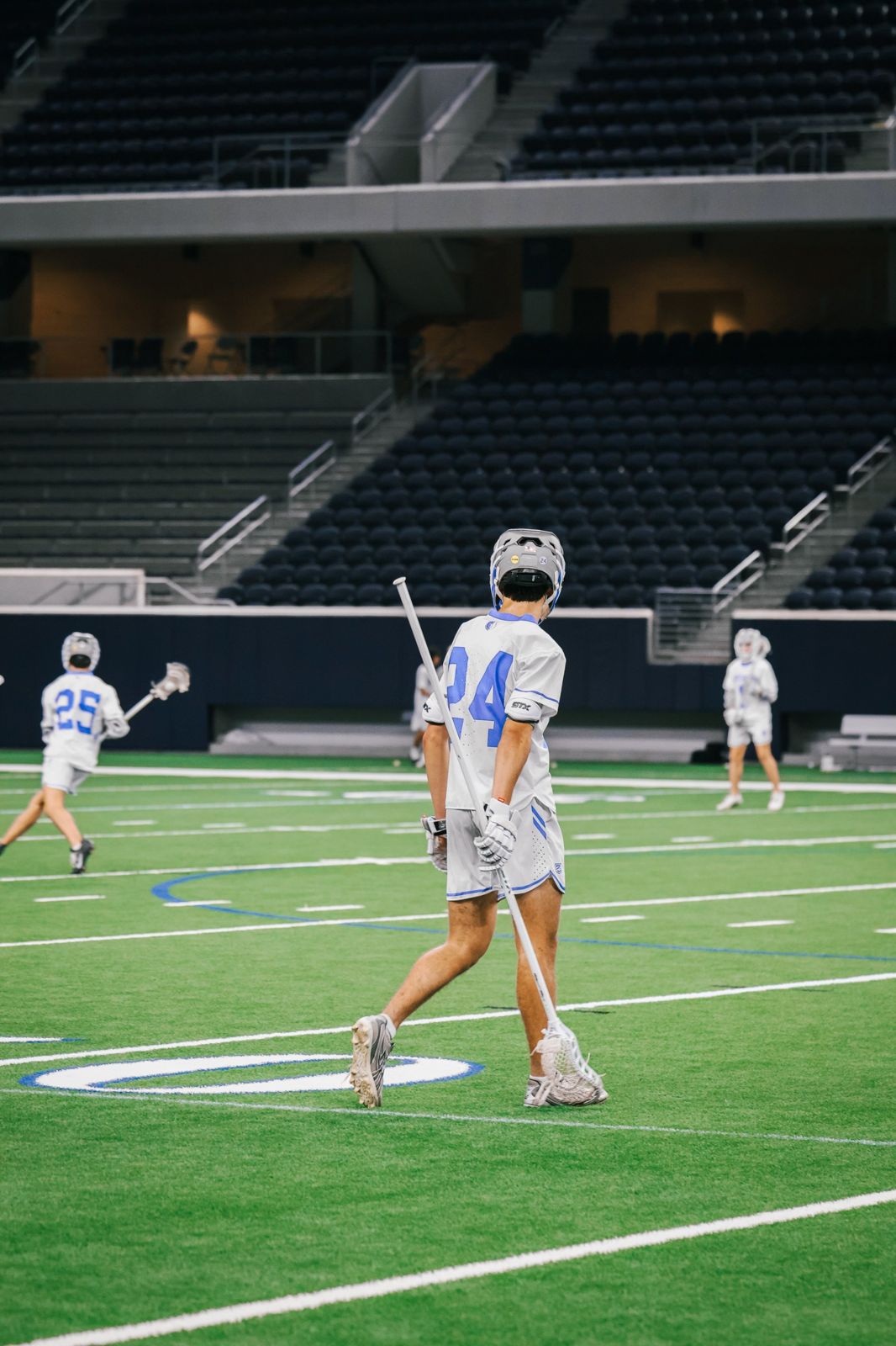 Frisco lacrosse attackman walking the field